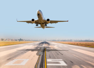 passenger plane fly up over take-off runway from airport